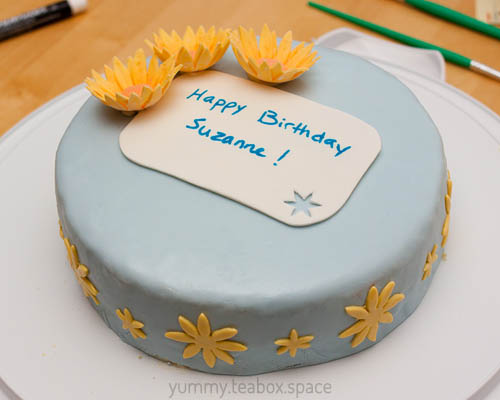 Birthday cake with yellow flowers
